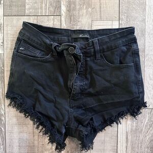 Kansan jean short in color black.  Size 9